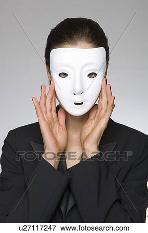 Female as business woman with mask View Large Photo Image Stock Photo - Female as business woman with mask. Fotosearch
