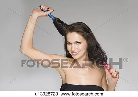 female beauty brushing hair View Large Photo Image Stock Image - female beauty brushing hair. Fotosearch