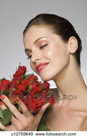Female beauty model smelling roses View Large Photo Image Stock Image - Female beauty model smelling roses. Fotosearch