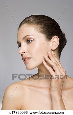 Female beauty model touching skin View Large Photo Image Stock Photograph - Female beauty model touching skin. Fotosearch