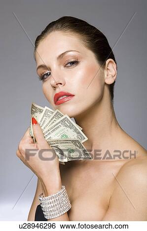 Female beauty model with money in hand View Large Photo Image Stock Photograph - Female beauty model with money in hand. Fotosearch
