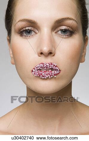 female beauty with candy on lips View Large Photo Image Stock Image - female beauty with candy on lips. Fotosearch