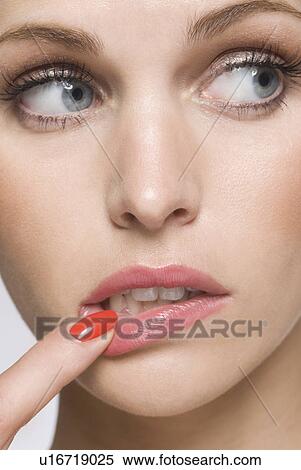 female beauty with finger in mouth View Large Photo Image Stock Photography - female beauty with finger in mouth. Fotosearch
