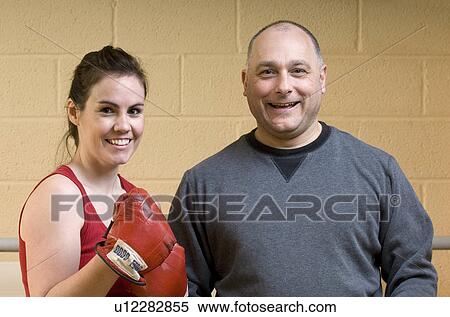 female boxer with instructor gym View Large Photo Image Stock Photography - female boxer with instructor gym. Fotosearch