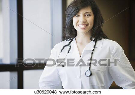 Female Doctor smiling View Large Photo Image Stock Photo - Female Doctor smiling. Fotosearch