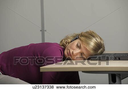 female worker asleep at desk View Large Photo Image Stock Photo - female worker asleep at desk. Fotosearch