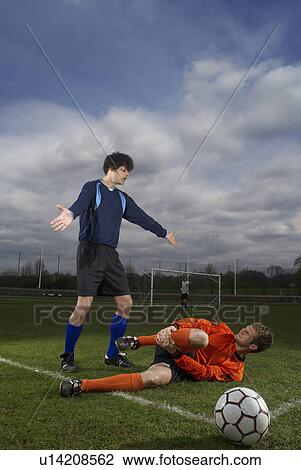 footballer fouled by another player View Large Photo Image Stock Image - footballer fouled by another player. Fotosearch