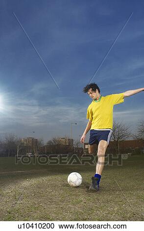 footballer kicking ball View Large Photo Image Stock Image - footballer kicking ball. Fotosearch