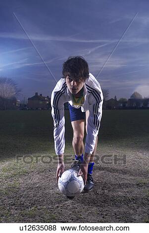footballer placing ball View Large Photo Image Stock Photo - footballer placing ball. Fotosearch