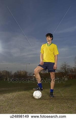 footballer standing with ball View Large Photo Image Stock Photo - footballer standing with ball. Fotosearch