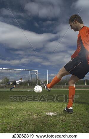 Stock Photo - footballer taking penalty. Fotosearch