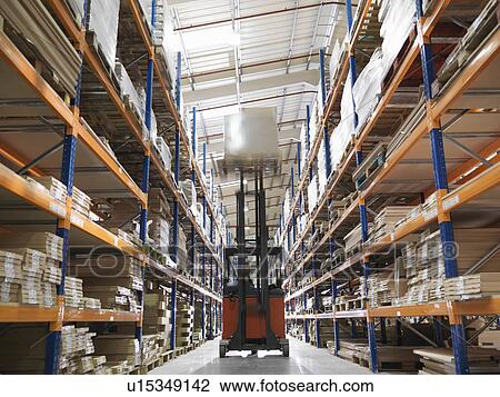 Stock Image - Forklift In Warehouse. Fotosearch