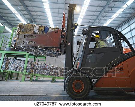 Stock Photo - Forklift Truck In Recycle Plant. Fotosearch
