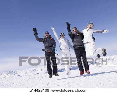 Stock Photo - Four people jumping around. Fotosearch