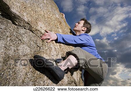 Stock Image - free climbing boulder. Fotosearch