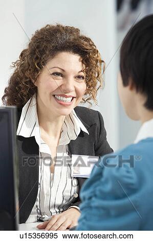 Stock Photography - Friendly customer service. Fotosearch