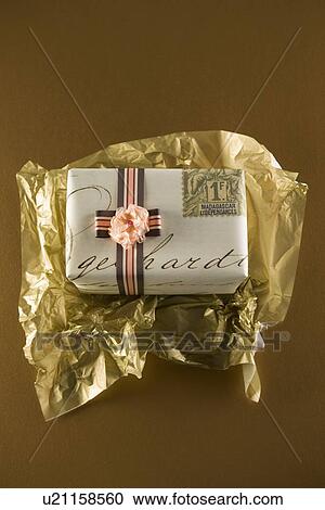 Gift being unwrapped View Large Photo Image Stock Image - Gift being unwrapped. Fotosearch