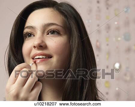 Girl, 14 applying make up View Large Photo Image Stock Photo - Girl, 14 applying make up. Fotosearch