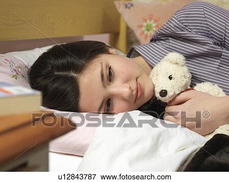 Girl, 14 holding teddy View Large Photo Image Stock Photo - Girl, 14 holding teddy. Fotosearch