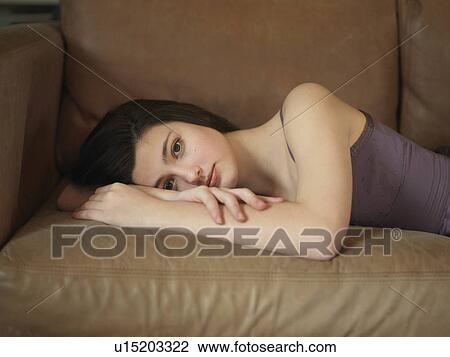 Girl, 14 relaxing on sofa View Large Photo Image Stock Image - Girl, 14 relaxing on sofa. Fotosearch