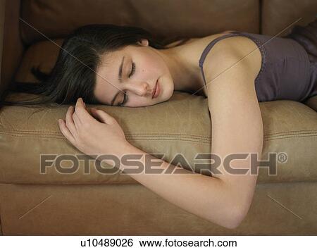 Girl, 14 sleeping on sofa View Large Photo Image Stock Photograph - Girl, 14 sleeping on sofa. Fotosearch