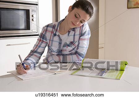 Girl 14, studying at home View Large Photo Image Stock Image - Girl 14, studying at home. Fotosearch