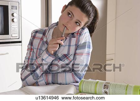 Girl 14, studying at home View Large Photo Image Stock Photograph - Girl 14, studying at home. Fotosearch