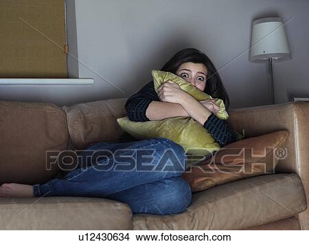 Girl, 14 watching scary movie View Large Photo Image Picture - Girl, 14 watching scary movie. Fotosearch