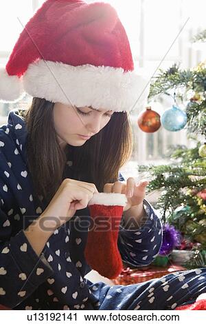 Girl, 14 with tiny Christmas stocking View Large Photo Image Stock Image - Girl, 14 with tiny Christmas stocking. Fotosearch