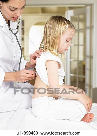 Stock Image - Girl at the doctor. Fotosearch