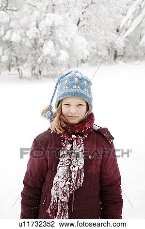 Girl covered in deep snow View Large Photo Image Stock Image - Girl covered in deep snow. Fotosearch
