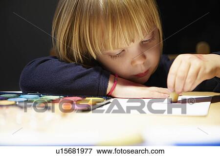 Stock Photo - Girl drawing a picture. Fotosearch