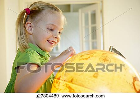 Stock Photo - Girl exploring the world. Fotosearch