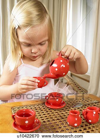 Girl having a tea time View Large Photo Image Stock Image - Girl having a tea time. Fotosearch