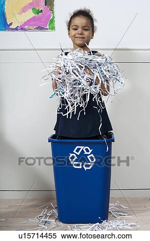 Stock Photography - girl in recycling bin. Fotosearch