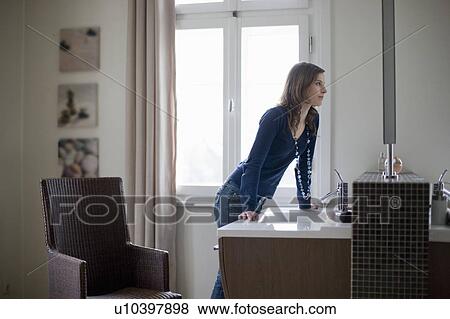 girl looking into bathroom mirror View Large Photo Image Stock Photo - girl looking into bathroom mirror. Fotosearch