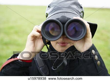 Girl looking through binoculars View Large Photo Image Stock Photo - Girl looking through binoculars. Fotosearch