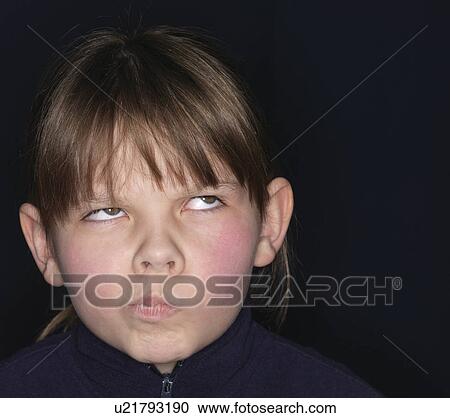 Girl making a grimace, close-up View Large Photo Image Stock Image - Girl making a grimace, close-up. Fotosearch