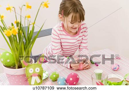 girl painting eggs for easter View Large Photo Image Stock Photo - girl painting eggs for easter. Fotosearch