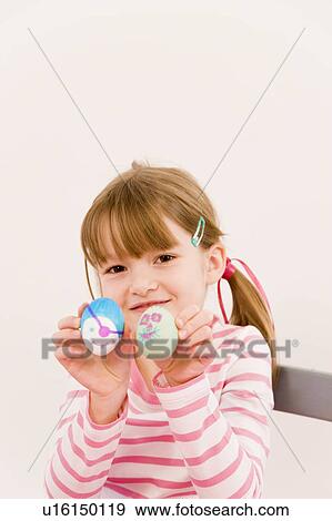 girl painting eggs for easter View Large Photo Image Stock Photo - girl painting eggs for easter. Fotosearch