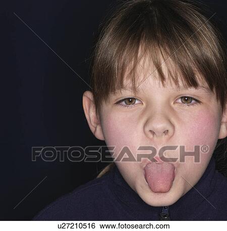 Girl sticking out tongue, close-up View Large Photo Image Stock Photograph - Girl sticking out tongue, close-up. Fotosearch