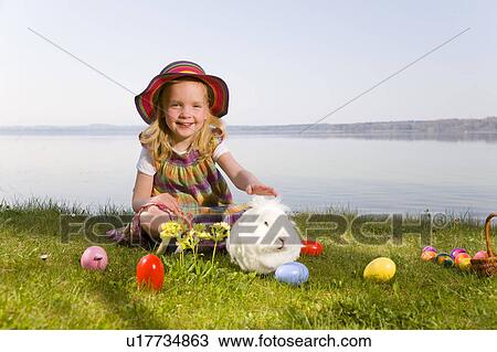 girl with bunny and easter eggs View Large Photo Image Stock Image - girl with bunny and easter eggs. Fotosearch