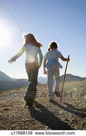 Girls hiking on Mountain View Large Photo Image Stock Photo - Girls hiking on Mountain. Fotosearch