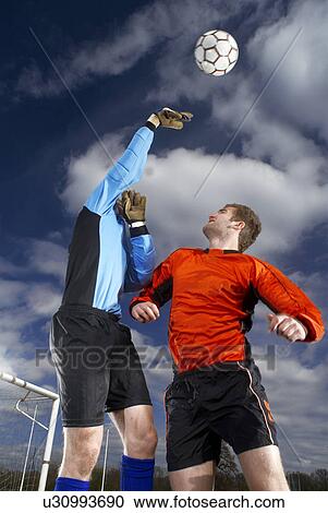 goalkeeper punching ball View Large Photo Image Stock Image - goalkeeper punching ball. Fotosearch