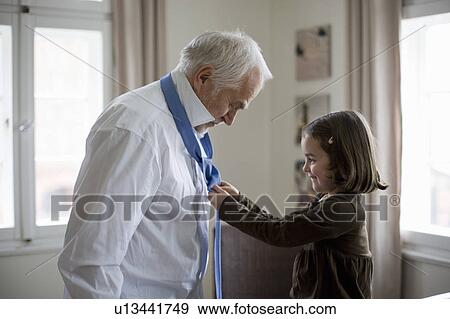 granddaughter helping grandfather View Large Photo Image Stock Photo - granddaughter helping grandfather. Fotosearch