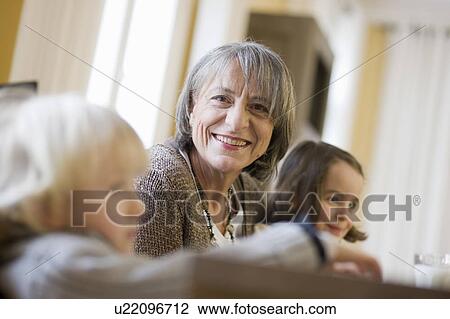 grandmother and grandchildren at table View Large Photo Image Stock Image - grandmother and grandchildren at table. Fotosearch
