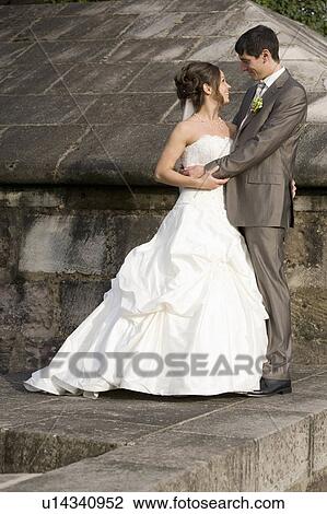 Groom hugging bride. View Large Photo Image Stock Image - Groom hugging bride.. Fotosearch