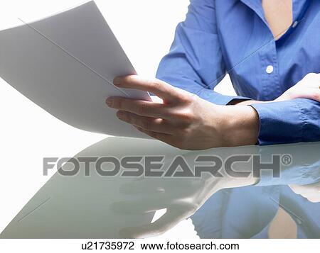 Hands of a woman, holding a file View Large Photo Image Stock Image - Hands of a woman, holding a file. Fotosearch