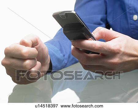 Hands of a woman, holding cellular phone View Large Photo Image Stock Photo - Hands of a woman, holding cellular phone. Fotosearch