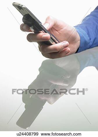 Hands of a woman, holding cellular phone View Large Photo Image Stock Photo - Hands of a woman, holding cellular phone. Fotosearch